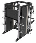 Back size of a heavy-duty black and silver Amstaff Artis Smith Machine featuring an integrated power rack, dual adjustable pulleys, pull-up handles, and various attachments including J-hooks and spotter arms.